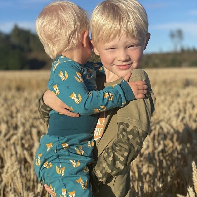 Two little boys wearing organic stylish outfits